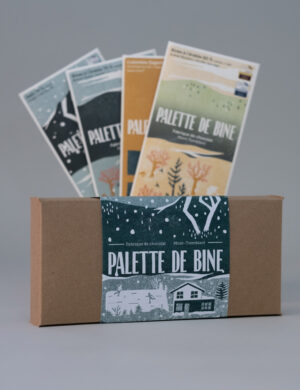 boite contenant un ensemble de 2 palettes de chocolat noir et 2 palettes de chocolat au lait
